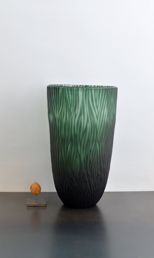 Green cut glass vase textured