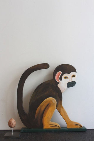 Wooden monkey sitting